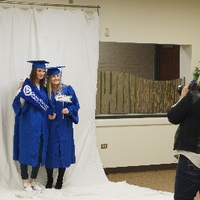 Two friends taking picture at GradFest